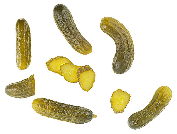 istock Pickled cucumbers and slices isolated on a white background , view from above. Flat lay. Set of delicious pickles. 2253017233