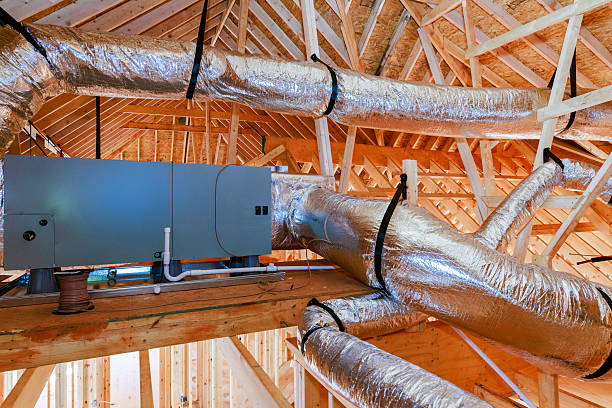 istock Workers install ventilation system in new building construction stage at residential area 2253022238