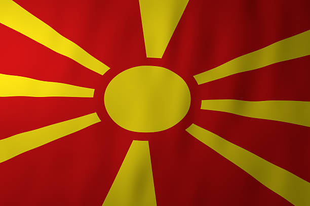 The national flag of North Macedonia featuring a stylized yellow sun with eight rays on a red field. The sun symbol represents freedom, independence, and national identity.