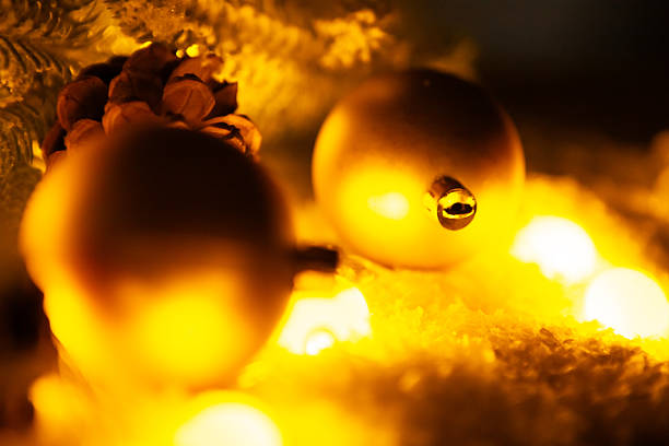 close view of christmas decorations and christmas tree on blurred background