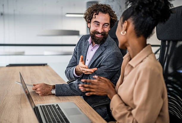 istock Business colleagues having meeting, discussing ideas in modern office 2253030171