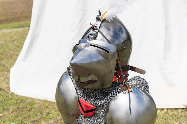old knight helmet and chain mail for protection in battle. is made of metal. of knightly armor