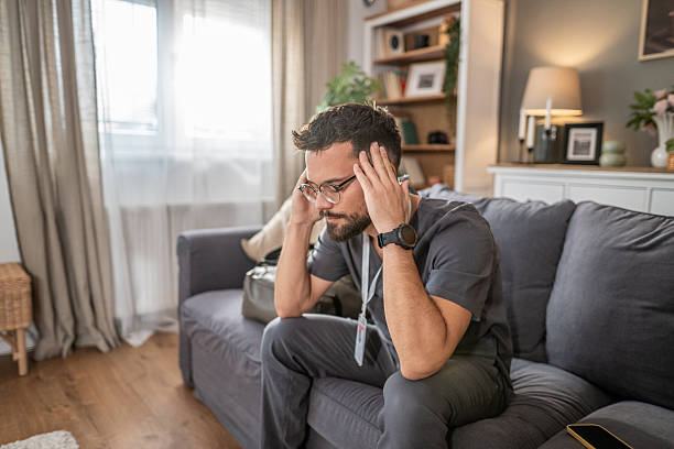 istock Stressed healthcare worker experiencing headache after long shift 2253031746