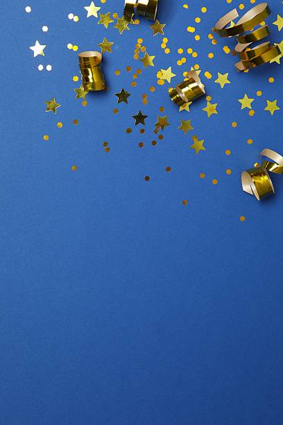 istock Golden confetti on blue background, top view 2253031898