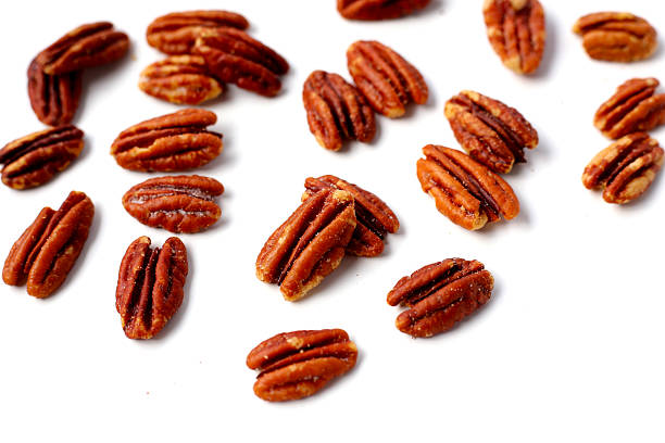 istock Delicious salted pecan nuts scattered. 2253032157
