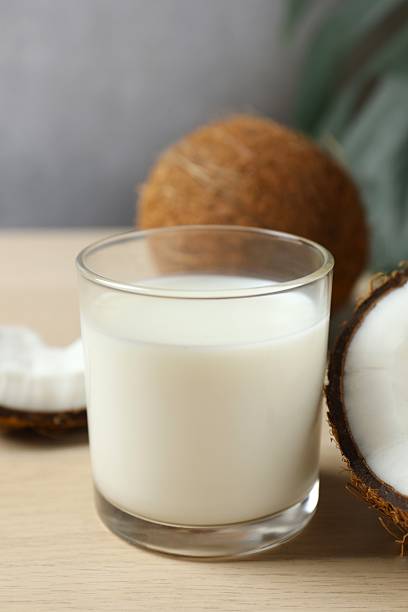 istock Glass of milk with coconuts on the table 2253032373