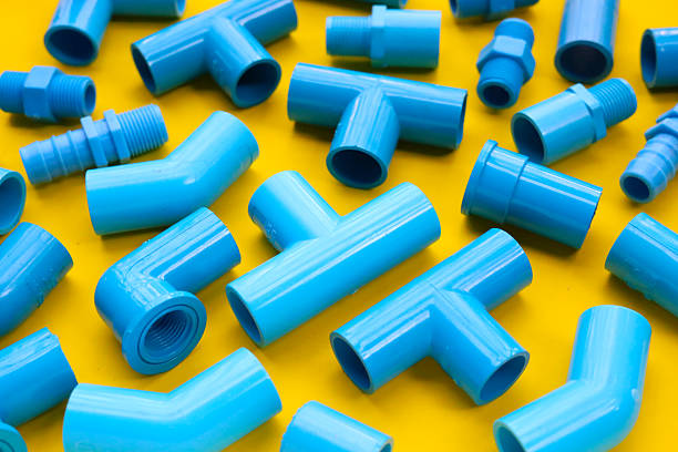 Assorted blue PVC connectors prepared for plumbing and piping work.
