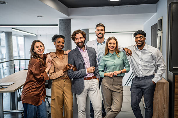 istock Diverse business team smiling at modern office 2253032648