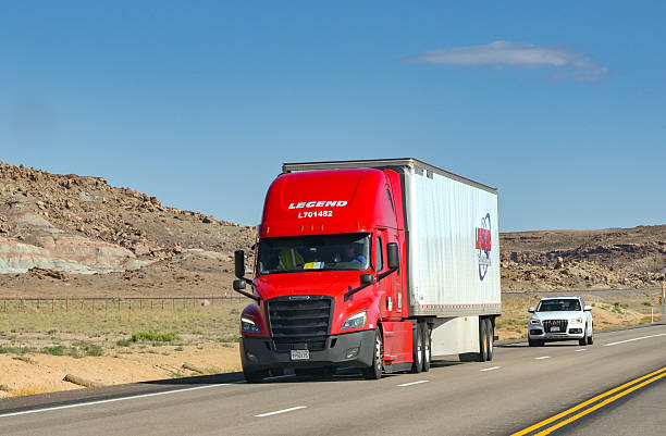Moab, Utah, USA - 26 May 2025: Articulated lorry carrying freight driving on a highway near Moab
