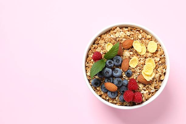 istock Delicious granola with berries on color background 2253033481