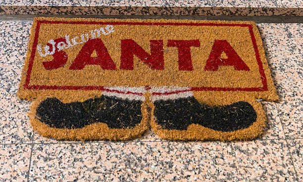 istock Santa welcome house mat entrance 2253033508