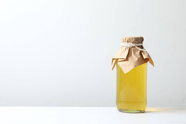 istock Bottle of fresh oil on white table 2253033760