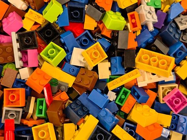 Energetic Colorful Bricks Scattered Across Frame, High Contrast Composition With Saturated Hues And Tactile