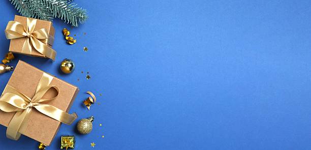 istock Festive banner with gift boxes and white embellishments, creating festive joy. Top view, space for text 2253034002