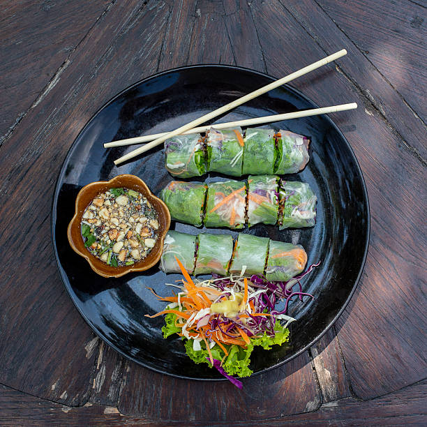istock Fresh vietnamese spring rolls on a plate with salad 2253034144
