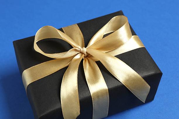 istock Beautiful festive gift box on blue background 2253034162