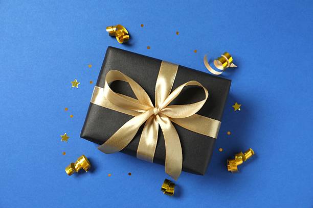 istock Beautiful festive gift box on color background 2253034171