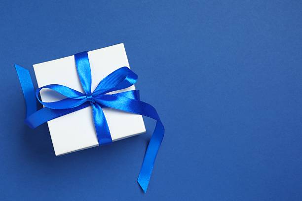 istock Beautiful festive gift box on color background 2253034184