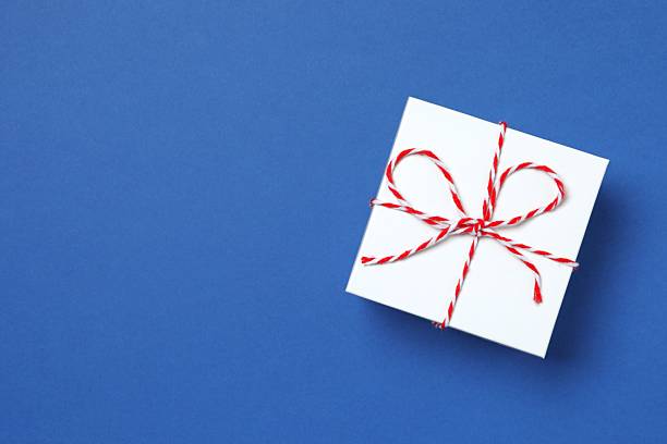 istock Beautiful festive gift box on color background 2253034187