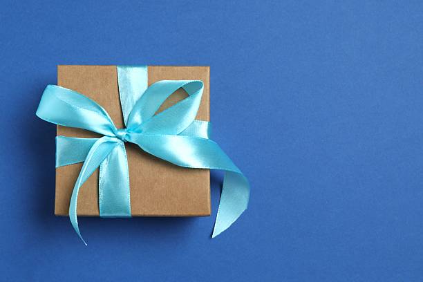 istock Beautiful festive gift box on color background 2253034334