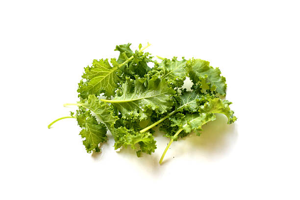 istock Fresh curly green kale leaves on white background. 2253034390