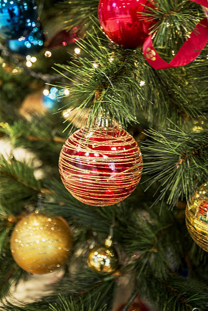 istock A red Christmas tree ball with glitter on a background 2253034745