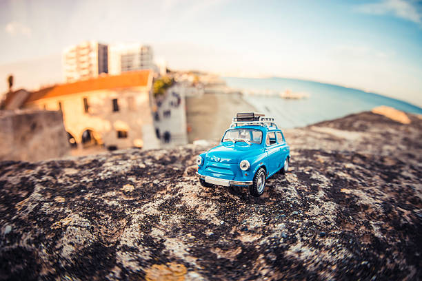 Miniature travelling car with luggage on a roof. Macro photography.