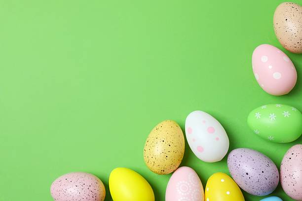 istock Happy Easter. Colorful eggs on color background, space for text or advertising 2253037392
