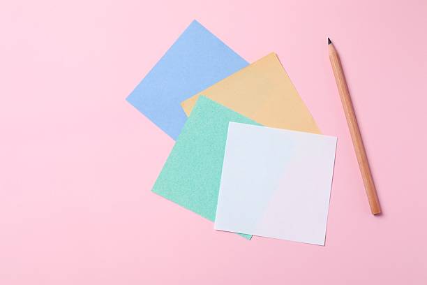 istock Multicolored paper stickers on a pink background 2253037537
