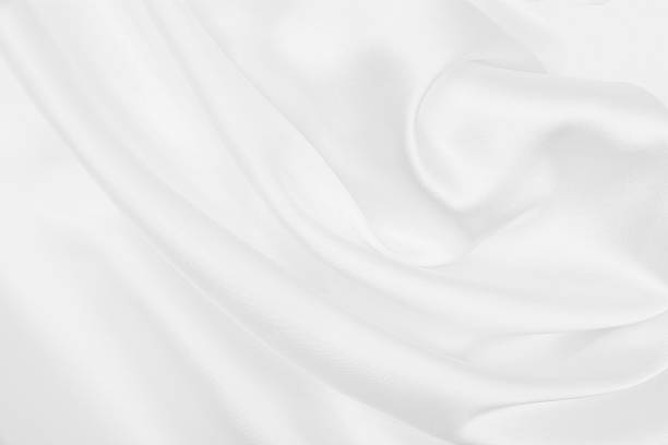 istock Smooth elegant white silk or satin luxury cloth texture as wedding background. Luxurious background design 2253037904