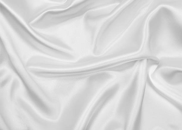 istock Smooth elegant white silk or satin luxury cloth texture as wedding background. Luxurious Christmas background or New Year background design 2253037912
