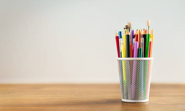 istock Colorful pencils and brushes in desk holder 2253038173