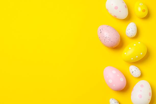 istock Happy Easter. Colorful eggs on color background, space for text or advertising 2253038954