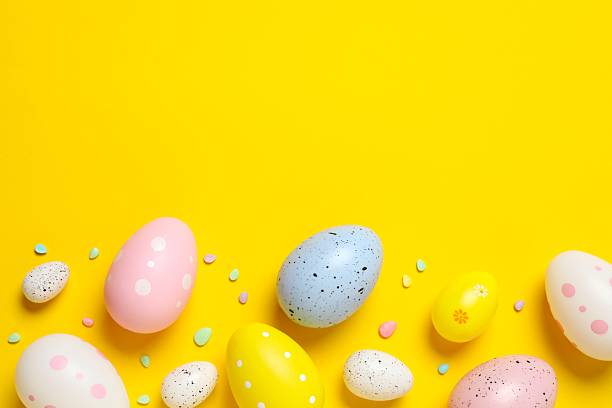 istock Happy Easter. Colorful eggs on color background, space for text or advertising 2253038966