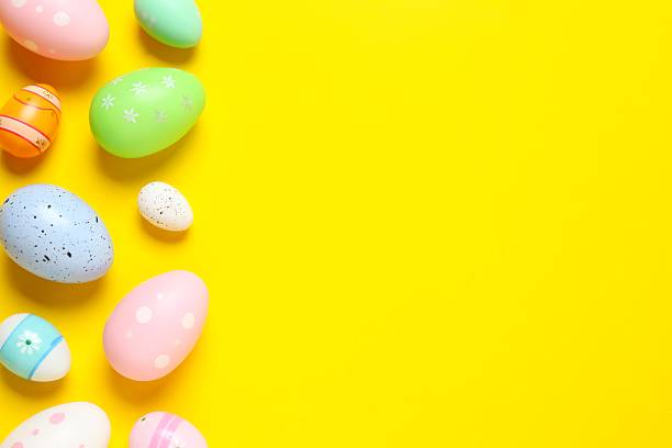 istock Happy Easter. Colorful eggs on color background, space for text or advertising 2253038968
