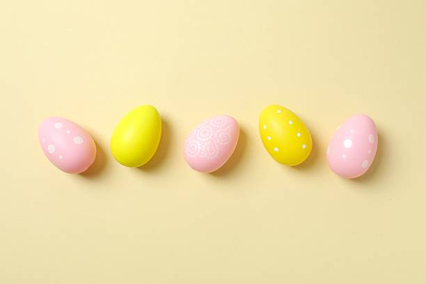 istock Happy Easter. Colorful eggs on color background, space for text or advertising 2253039015