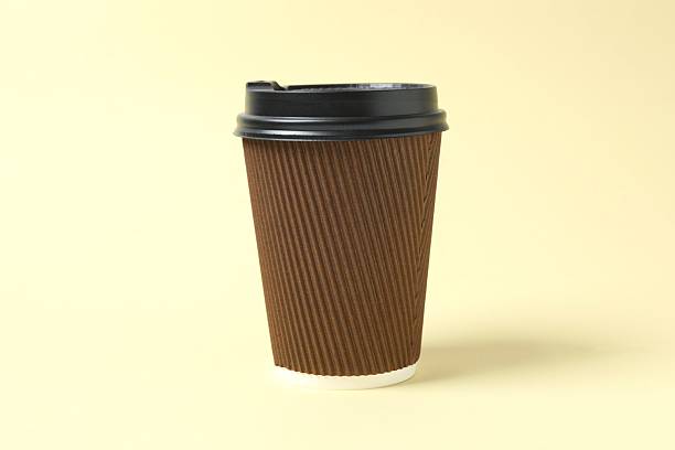 istock Paper cup of coffee on beige background 2253039032