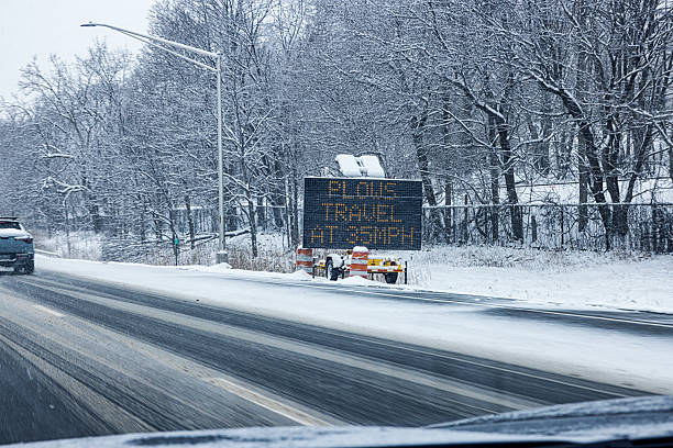 istock Winter Snow Plows Travel at 35 MPH Warning Sign 2253041331