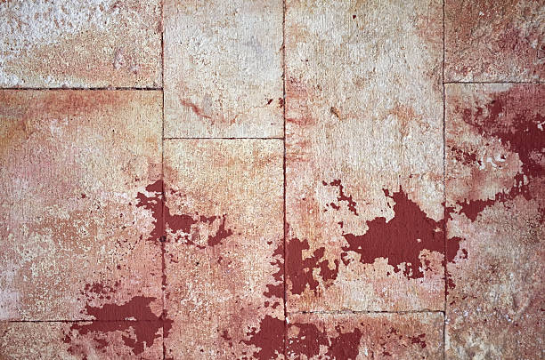 Texture grunge cracked motley background old wall red pink colors, full frame