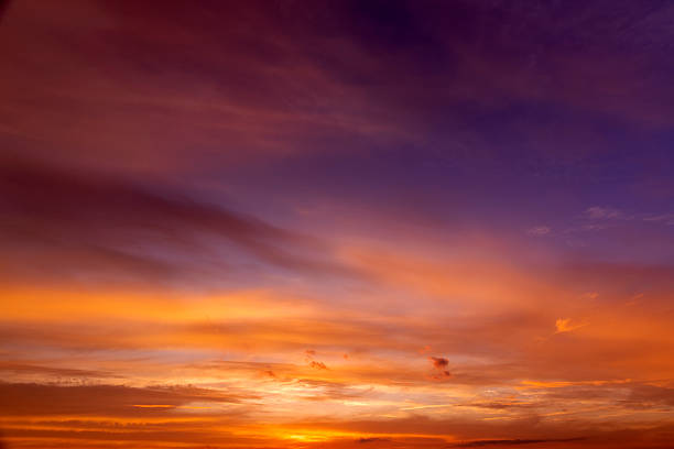 istock Beautiful multi-colored sunset with different colors and clouds as the sun sets over the horizon, multi-colored sky with warm colors , sunset or sunrise 2253044676