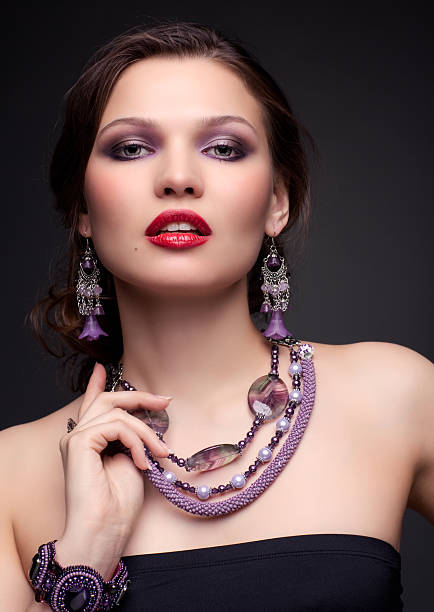 istock Beautiful young woman in necklace 2253053145