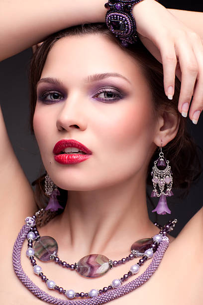 istock Beautiful young woman in necklace 2253053677
