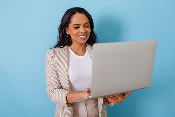 istock Young woman client using laptop computer for work, connecting remotely in video call on blue background 2253056760