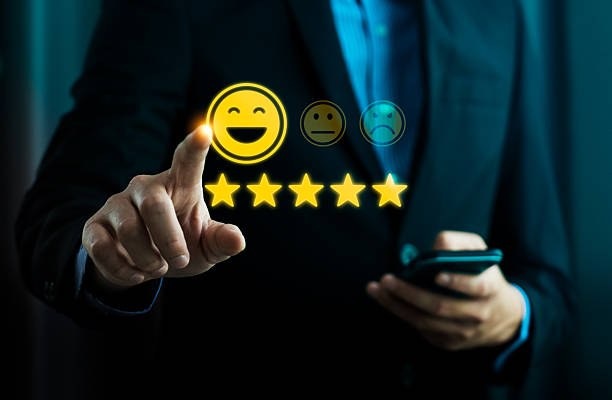 istock Customer satisfaction rating concept with five star review and smiley face interface, user selecting positive feedback via digital experience to represent service quality and brand trust 2253057740