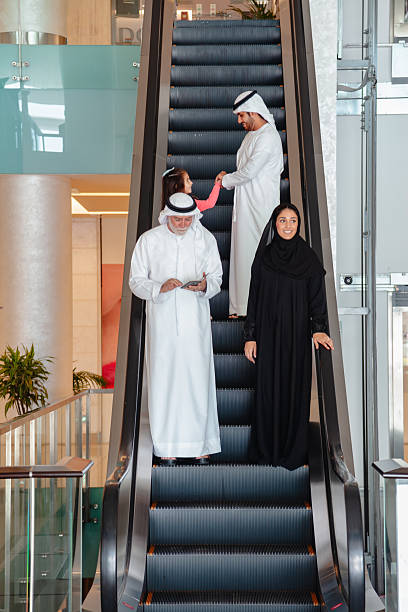 istock Middle Eastern Three Generation Family Walking Together in Modern Shopping Mall Interior 2253058314