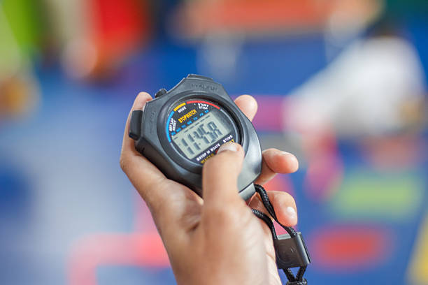 Hand Holding Stopwatch for Time Management and Sports Training