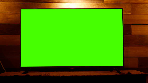 istock Green Screen TV in front of Rustic Feature Wall in Finished Basement 2253058459