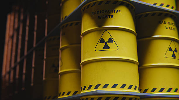 istock Rows of yellow radioactive waste barrels in storage. 3d rendering 2253058659