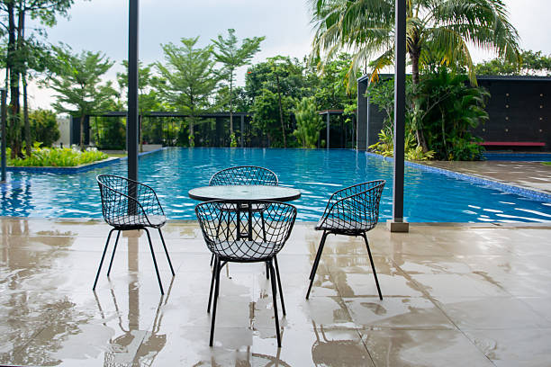 Table and chairs beside the swimming pool