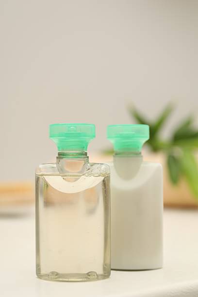 istock Mini bottles of cosmetic products on white table against blurred background 2253061748